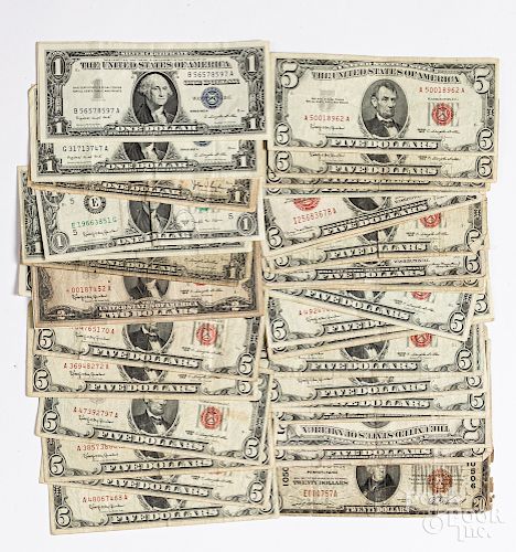 US paper currency, mostly red and blue seal notes
