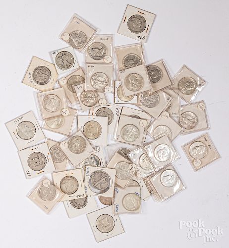 Twenty-eight Franklin silver half dollars