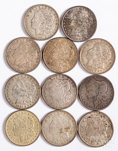 Eleven Morgan silver dollars