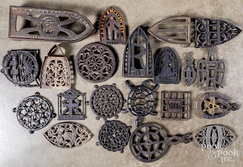 Thirty-five cast iron trivets, 19th/20th c.