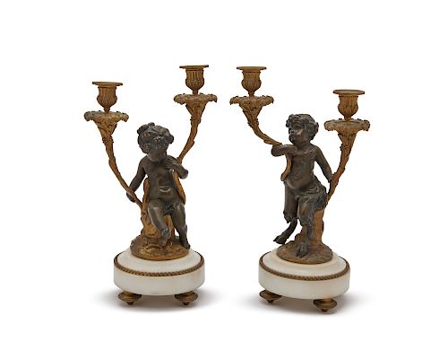 Pair of Louis XV Style Gilt and Patinated Bronze Two Light Figural Candelabra mounted on white marble bases