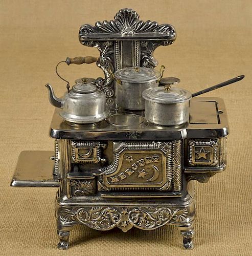 Cast iron and nickel Mercury toy stove with tin