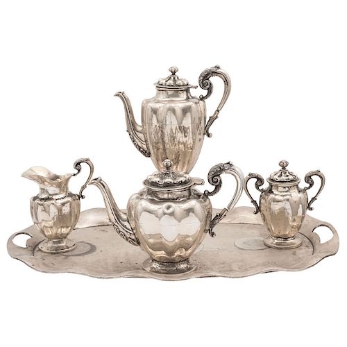 TEA SET. MEXICO, 20TH CENTURY. Sterling 0.925 Silver. Marked NIETO. Wave design with vegetal motifs. Weight: 5,281 g