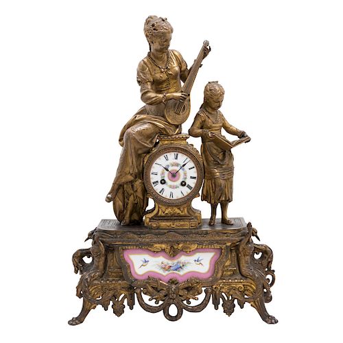 MANTEL CLOCK. CIRCA 1900. LOUIS PHILIPPE Style. Gilded bronze, gilded antimony and porcelain aplications. 21.5 in tall.