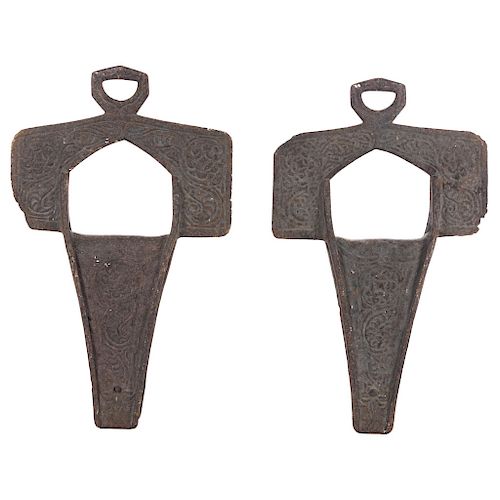 A PAIR OF CROSS STIRRUPS. MEXICO, LATE 19TH CENTURY. Iron decored with floral and geometric motifs. Marked "S". 14 x 8 in