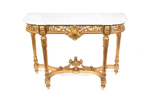 A Louis XVI Style Carved Giltwood Console Table
Height 38 1/4 x width 52 1/2 x depth 18 3/4 inches.