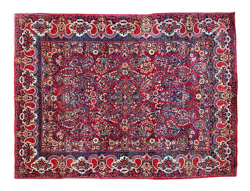 A Sarouk Wool Rug
10 feet 2 inches x 7 feet 11 inches.