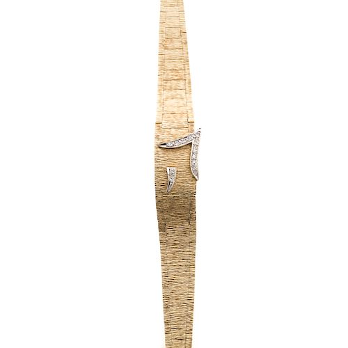 A Ladies Diamond Geneve Covered Watch in 14K