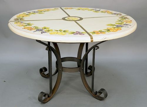 Coccozella signed porcelain top table with brass banding and hand painted fruit on iron base. ht. 30 1/2 in., dia. 51in.