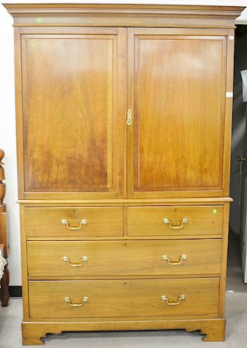 English mahogany armoire cabinet in two parts, two doors on base with two drawers over two drawers, late 19th century. ht. 78 in., wd. 52 in.