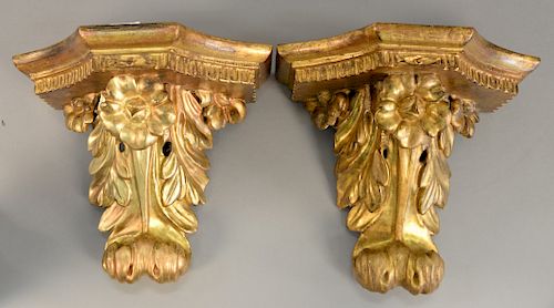 Pair of carved gilt wall brackets. ht. 12 in., wd. 14 1/2 in.