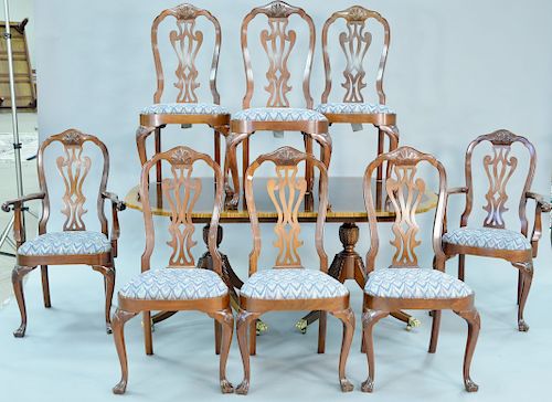 Councill dining set having eight Queen Anne style chairs with two arms plus shaped top table with banded inlaid three leaves and custom pads. ht. 29 i