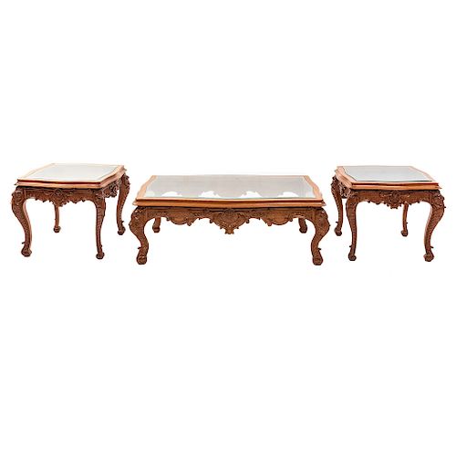 Mesa de centro y 2 mesas laterales. Siglo XX. En talla de madera. Con cubiertas de cristal biselado. 47 x 130 x 80 cm y 47 x 65 x 65 cm