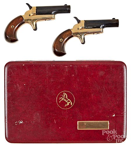 Pair of Colt single shot side lever pistols