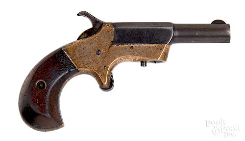 Unknown brass frame side swing spur trigger pistol