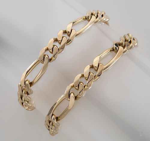 (2) matching gents 14K gold link bracelets.