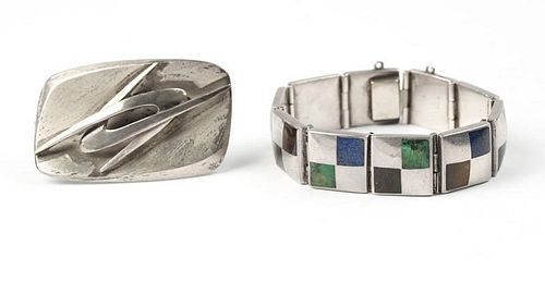 A stone and silver bracelet with a silver brooch