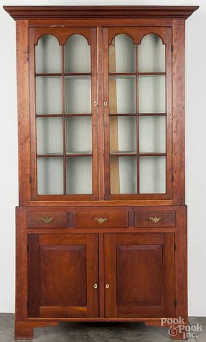 Pennsylvania cherry two-part corner cupboard, early 19th c., 83 1/2'' h., 43 1/2'' w.