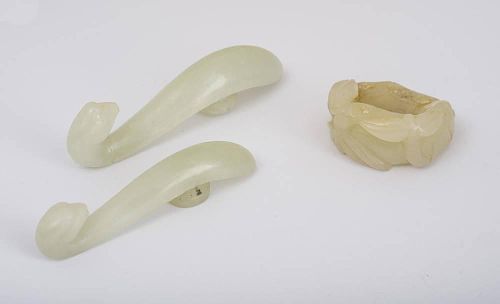 Two Chinese Mutton Fat Jade Clasps and a Ring