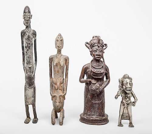 Dogon Metal Figure of a Man Holding a Fish, a Dogon Kneeling Mother, a Figure of a Woman Holding a Jug and a Cameroon Silvered Metal Figure of a Woman