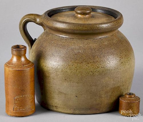 Two pieces of stoneware, to include a covered 1 1/2 gallon jug, 8 1/4'' h., and a J. Bourne & Son