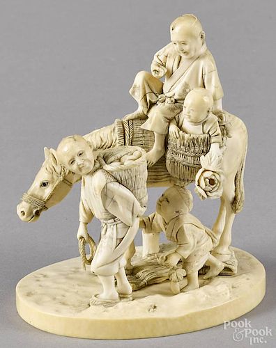 Japanese Meiji period carved ivory group of men and children with a horse, 4 1/4'' h.