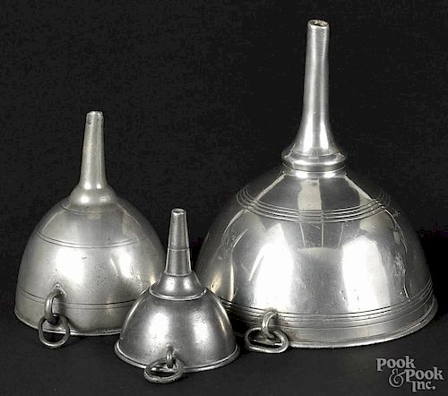 Three English pewter wine funnels, 18th c., unmarked, graduated sizes, largest - 6 1/2'' h.