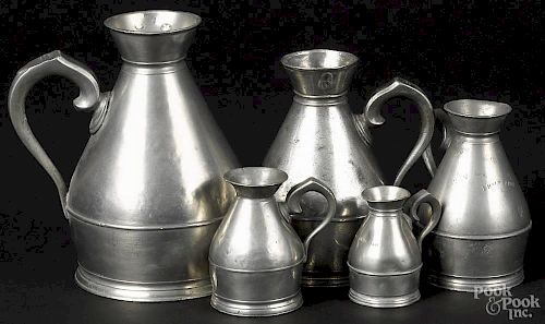 Five Irish pewter haystack measures, 19th c., sizes ranging from a half noggin to one quart