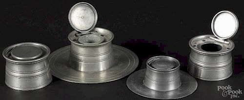 Four English pewter inkwells, 19th c., with hinged covers, largest having a porcelain cup insert