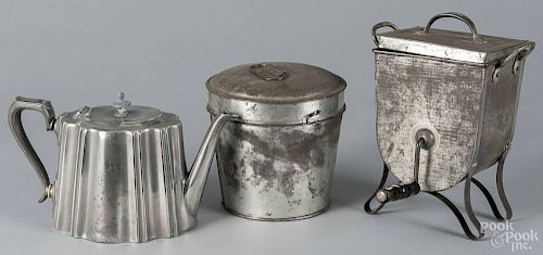 Tin and pewter kitchenwares, 19th c., to include molds, a sifter, etc.