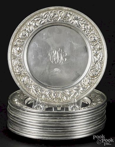 Set of twelve Stieff repoussé sterling silver plates, 6 1/8'' dia., 48 ozt.