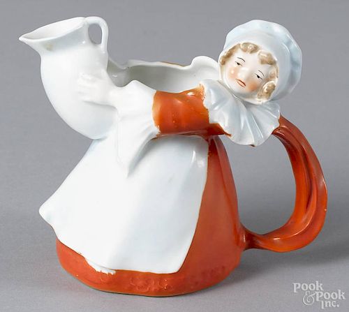 Royal Bayreuth porcelain girl with pitcher creamer with a blue mark on base, 4'' h.