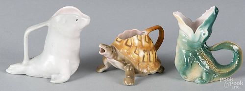 Three Royal Bayreuth porcelain creamers, to include a gray seal, 4'' h., a turtle, 2'' h.