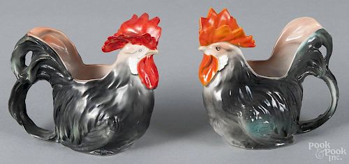 Two Royal Bayreuth porcelain black rooster creamers, one with a blue mark on base, 4'' h.