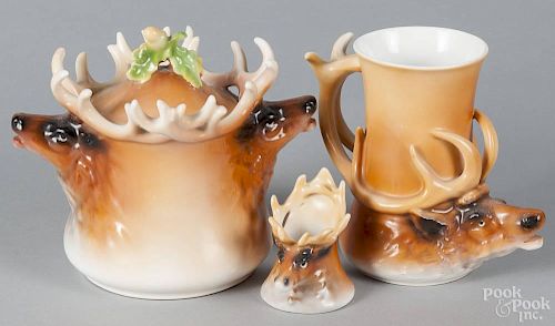 Royal Bayreuth porcelain elk grouping, to include a beer stein, 5 3/4'' h., a humidor, 6 1/2'' h.