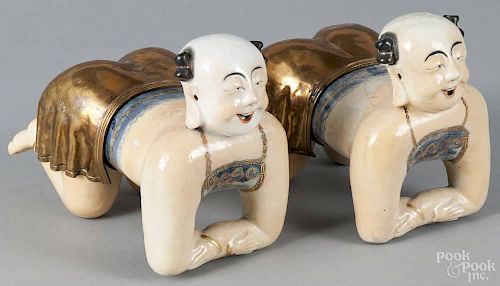 Pair of Chinese export porcelain figural pillows, 19th c., 6'' h., 8 1/2'' l.