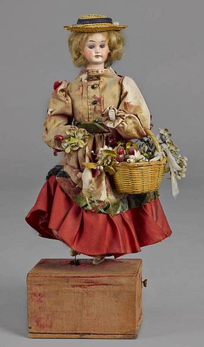 Bisque head automaton doll, ca. 1900, with a musi