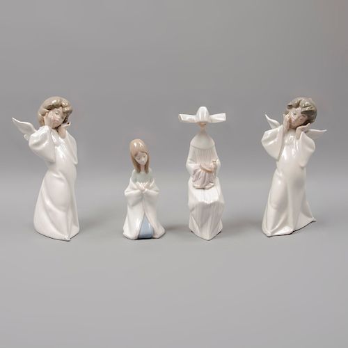 Lote de 4 figuras decorativas. España.  Ca. 1960, 1970 y 1987. En porcelana Lladró. Consta de: niña rezando, monja bordando, otros.