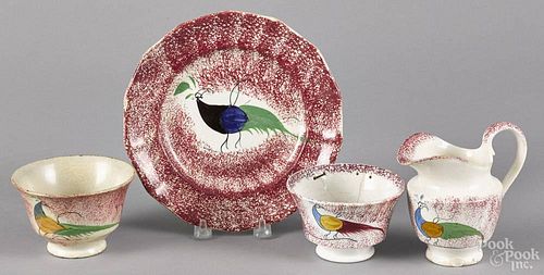 Red spatter plate with peafowl decoration, 7 3/8'' dia., together with a peafowl creamer