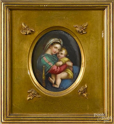 Two painted porcelain plaques, one with the Mother and Child, the other featuring the Virgin Mary