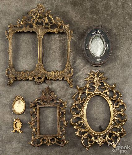 Five brass frames, together with a silver plated frame, 19th/20th c., largest - 11'' x 9 3/4''.