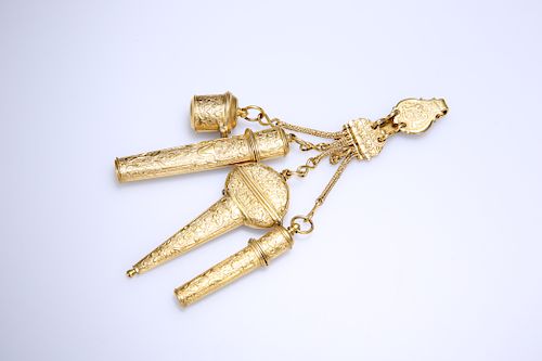 A 19TH CENTURY GILT METAL CHATELAINE, the oval hook plate a