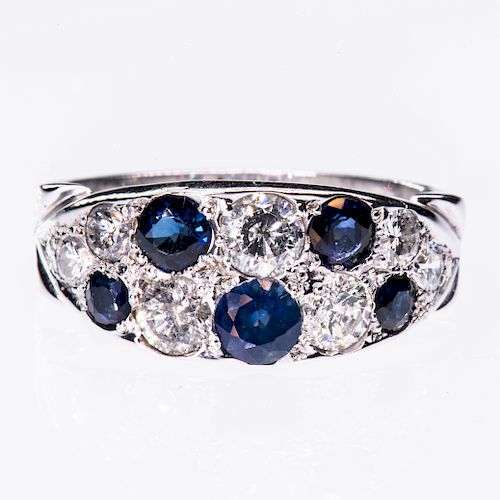 A SAPPHIRE AND DIAMOND RING, the tapering mount set through