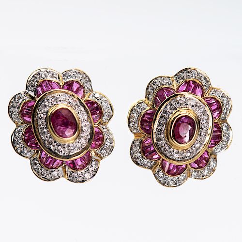 A PAIR OF RUBY AND DIAMOND CLUSTER EARRINGS, the central ov