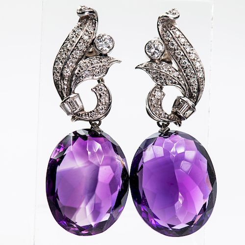 A PAIR OF ART DECO AMETHYST AND DIAMOND EARRINGS, the scrol