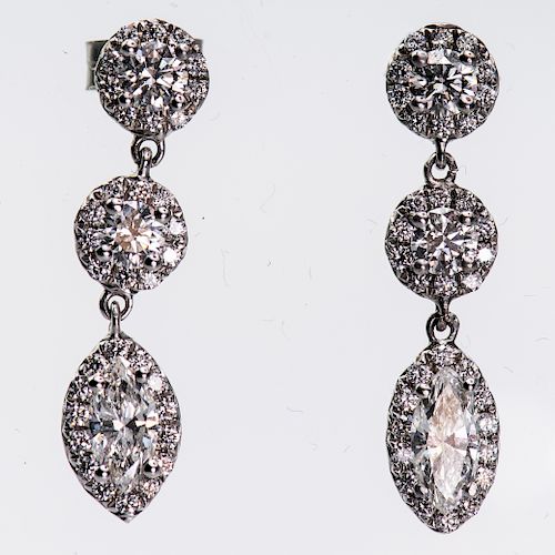 A PAIR OF CONTEMPORARY DIAMOND EARRINGS, of three articulat