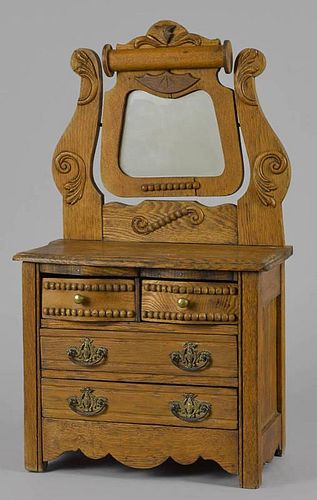 Oak doll dresser with a mirror, ca. 1900, and bea