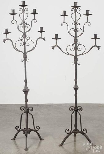 Pair of wrought iron torchiers, in the manner of Yellin, 64 1/2'' h.