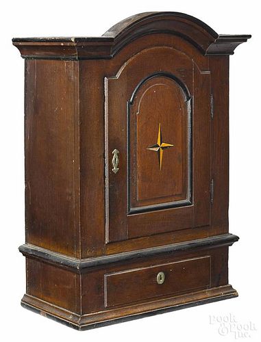 Continental oak hanging cupboard, ca. 1760, with a star inlaid door, 37'' h., 23'' w.