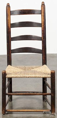 Child's ladderback chair, early 19th c., retaining an old brown surface.
